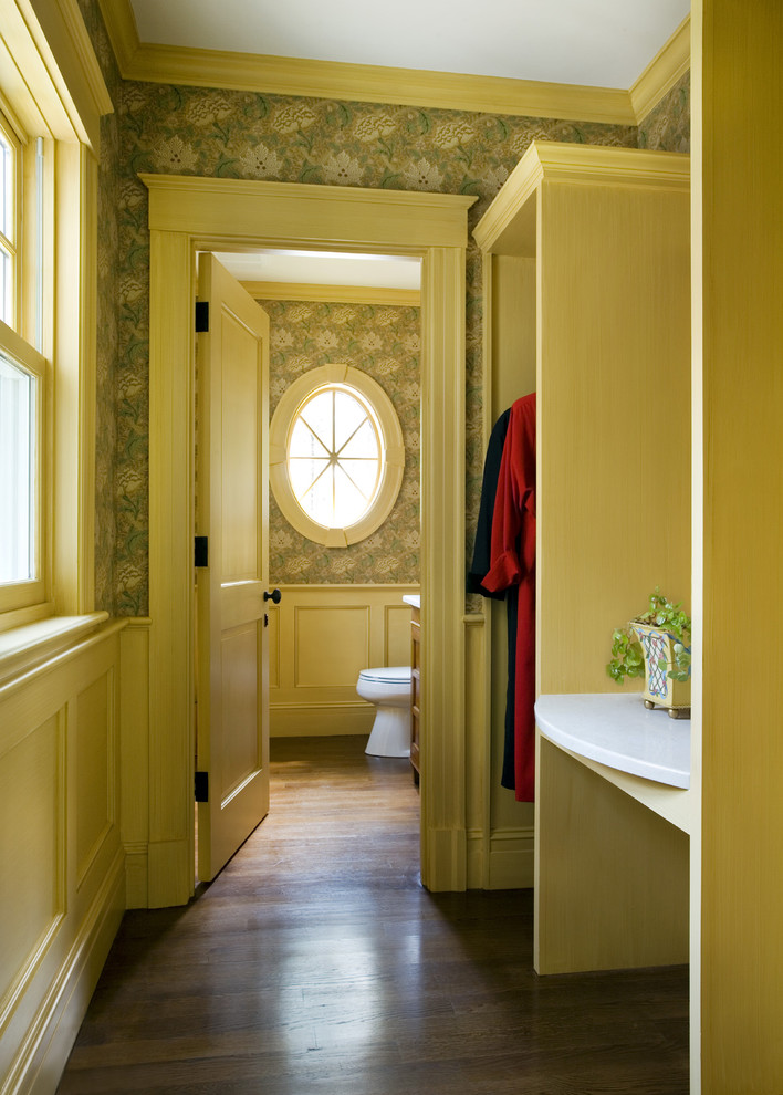 Example of a classic women's dark wood floor reach-in closet design in Boston with open cabinets and light wood cabinets