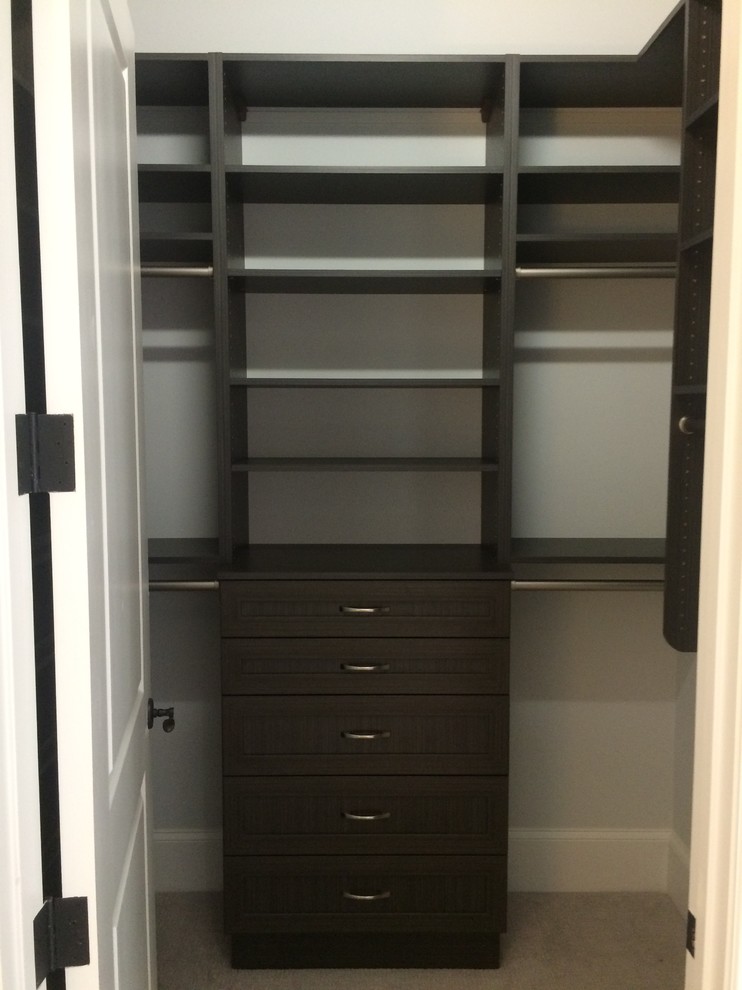 Mid-sized minimalist gender-neutral carpeted and beige floor walk-in closet photo in Miami with shaker cabinets and brown cabinets