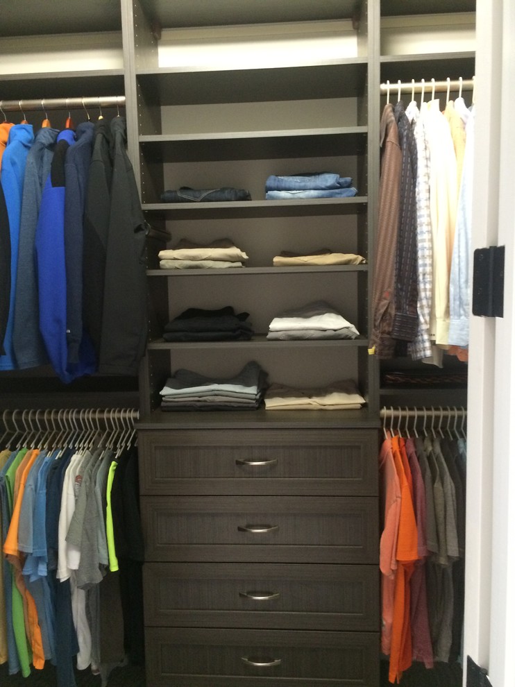 Mid-sized minimalist gender-neutral carpeted walk-in closet photo in Miami with shaker cabinets and brown cabinets