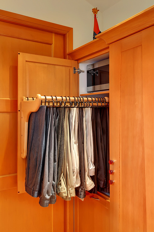 Example of a small eclectic men's dressing room design in Seattle