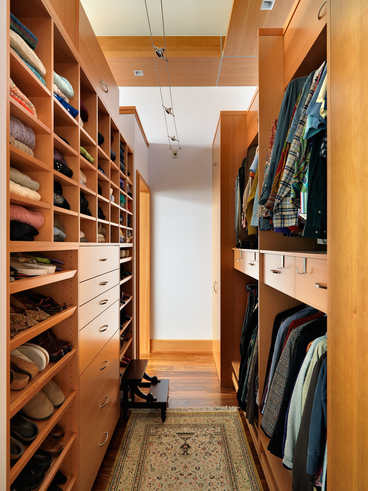 Example of a trendy walk-in closet design in Vancouver