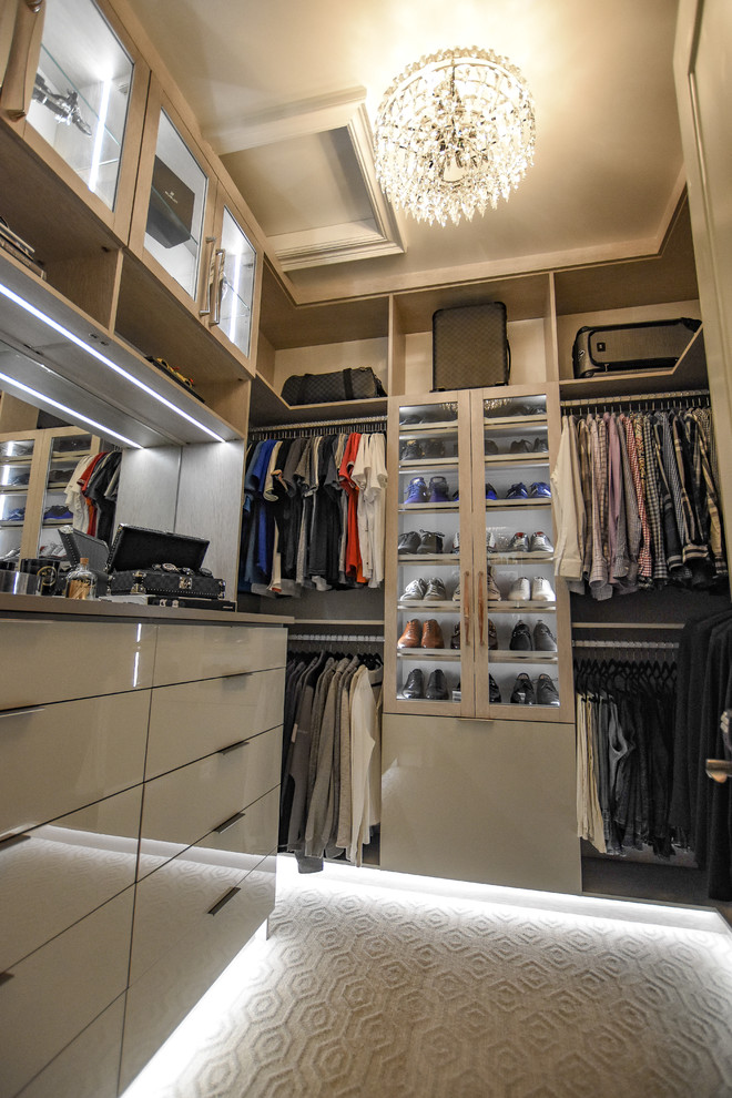 Mid-sized transitional men's carpeted and gray floor walk-in closet photo in Detroit with glass-front cabinets and light wood cabinets