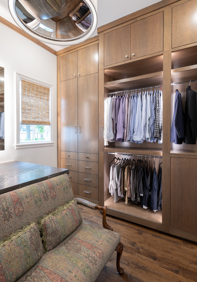 Walk-in closet - mid-sized transitional men's medium tone wood floor and brown floor walk-in closet idea in Dallas with flat-panel cabinets and medium tone wood cabinets
