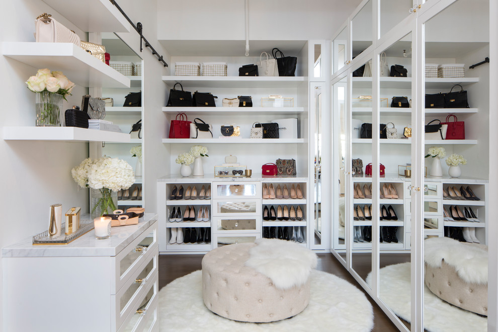 Transitional women's dark wood floor dressing room photo in Los Angeles with white cabinets
