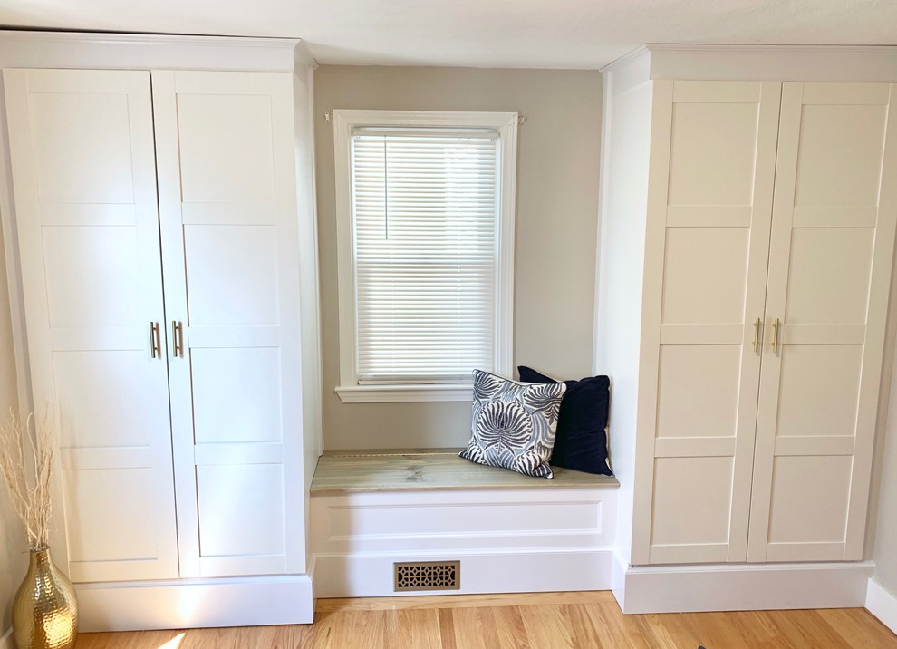 Photo of a medium sized classic dressing room in Providence with shaker cabinets and white cabinets.