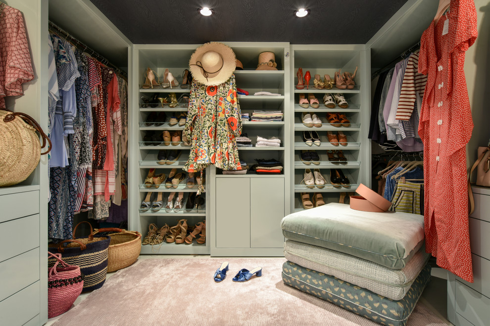 Walk-in closet - transitional women's carpeted and beige floor walk-in closet idea in Miami with flat-panel cabinets and green cabinets