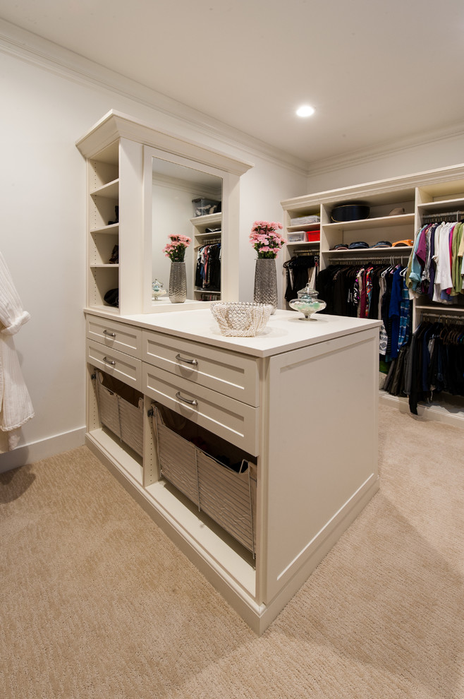 Photo of a medium sized classic gender neutral walk-in wardrobe in Hawaii with shaker cabinets, white cabinets and carpet.