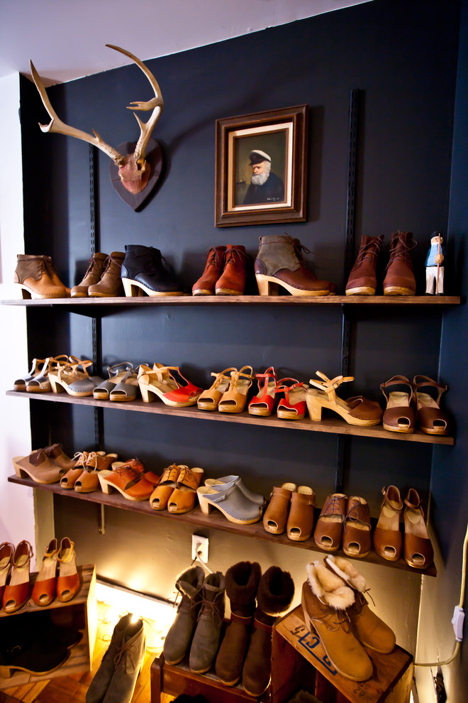 Inspiration for an eclectic women's closet remodel in New York with open cabinets