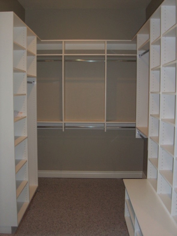 Example of a mid-sized gender-neutral walk-in closet design in Salt Lake City