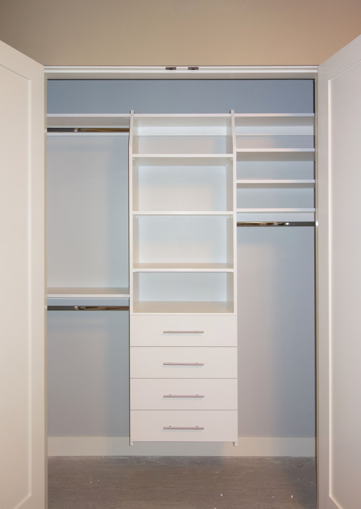 Inspiration for a medium sized classic gender neutral standard wardrobe in Vancouver with flat-panel cabinets, white cabinets and carpet.