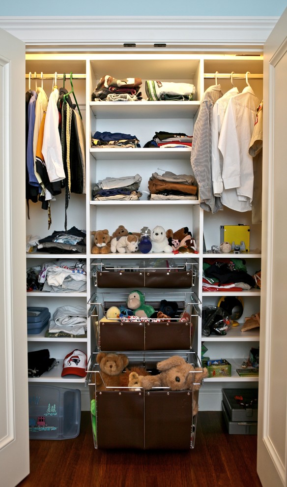 Example of a classic reach-in closet design in Boston with open cabinets and white cabinets