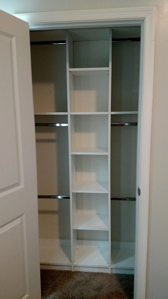 Photo of a small contemporary standard wardrobe for women in DC Metro with white cabinets and carpet.