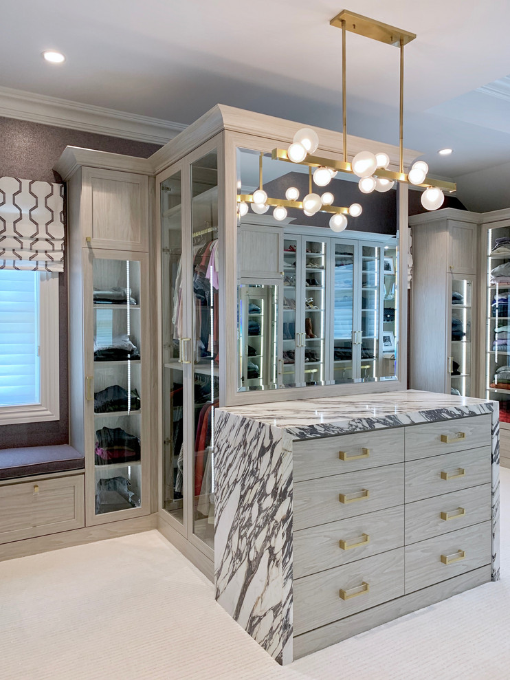 Minimalist women's carpeted and gray floor dressing room photo in New York with recessed-panel cabinets and light wood cabinets