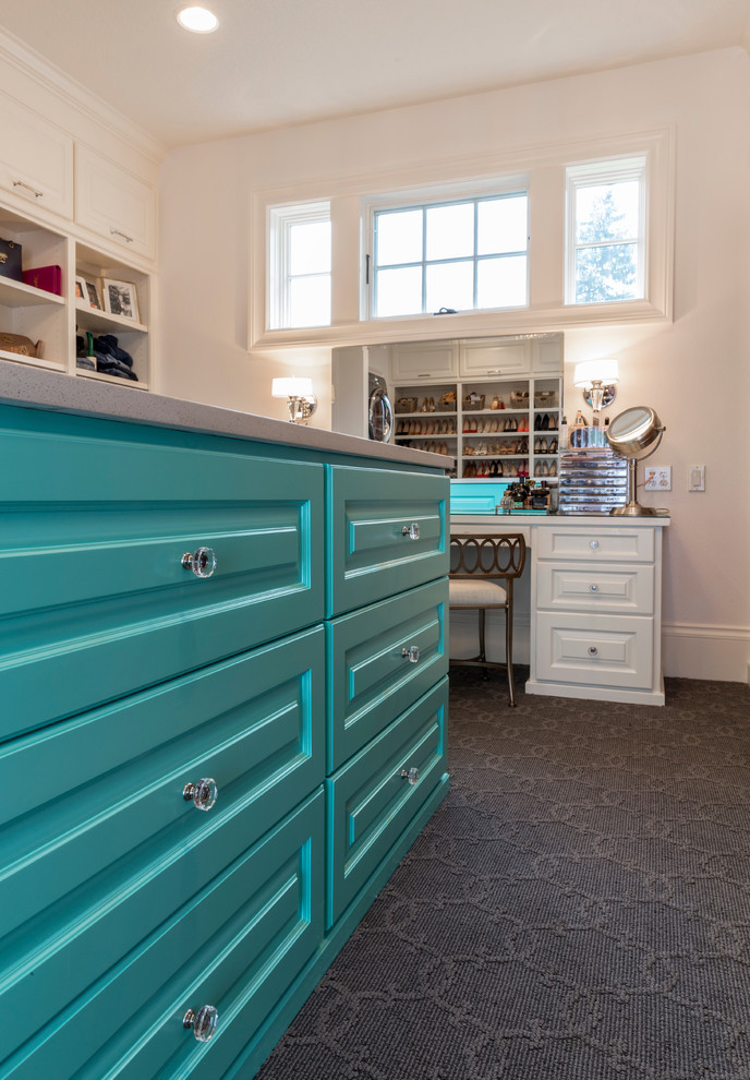 Design ideas for an expansive classic gender neutral walk-in wardrobe in Portland with beaded cabinets, blue cabinets, carpet and grey floors.