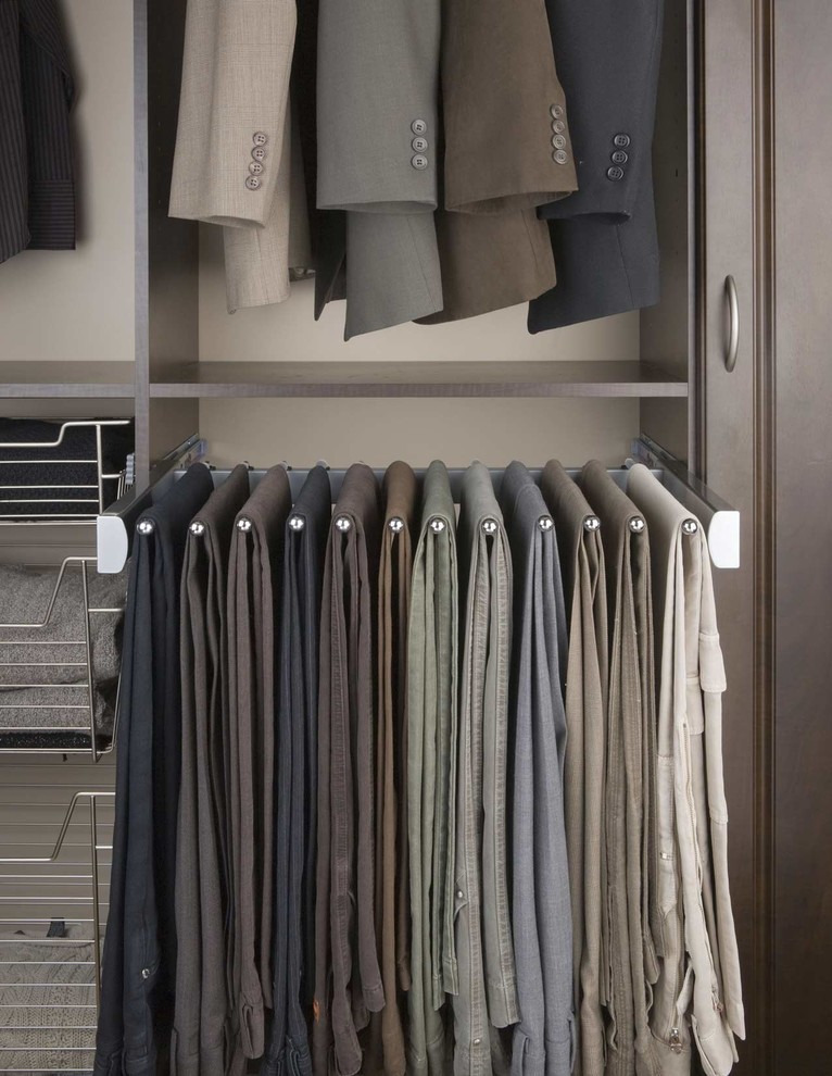Inspiration for a large contemporary gender neutral walk-in wardrobe in Other with raised-panel cabinets, dark wood cabinets, carpet and beige floors.
