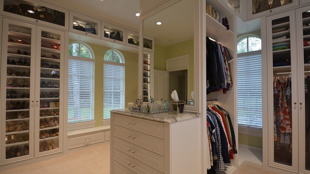 Walk-in closet - large transitional women's carpeted walk-in closet idea in Orange County with glass-front cabinets and white cabinets