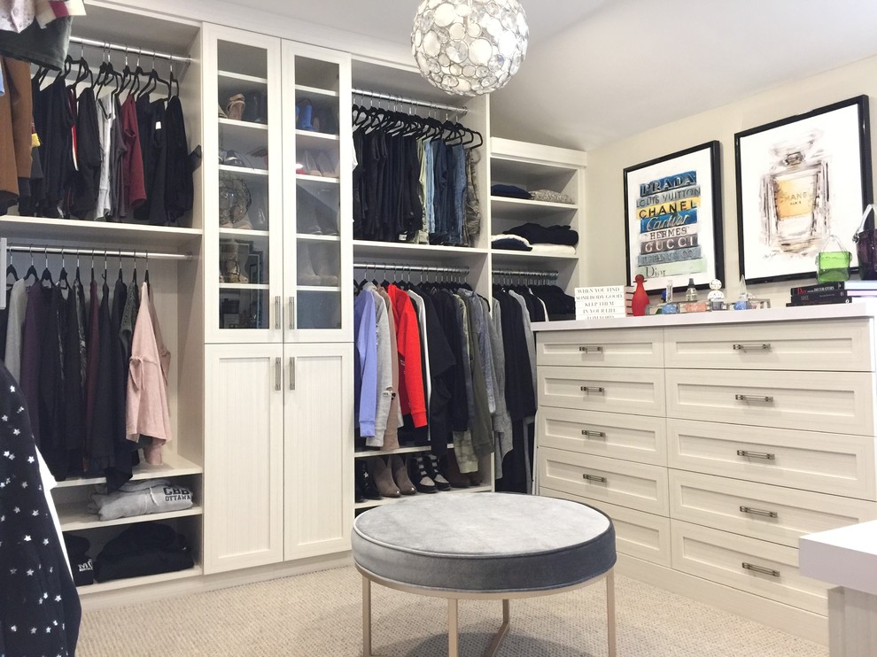 Design ideas for a large traditional walk-in wardrobe for women in Montreal with shaker cabinets, grey cabinets, carpet and grey floors.