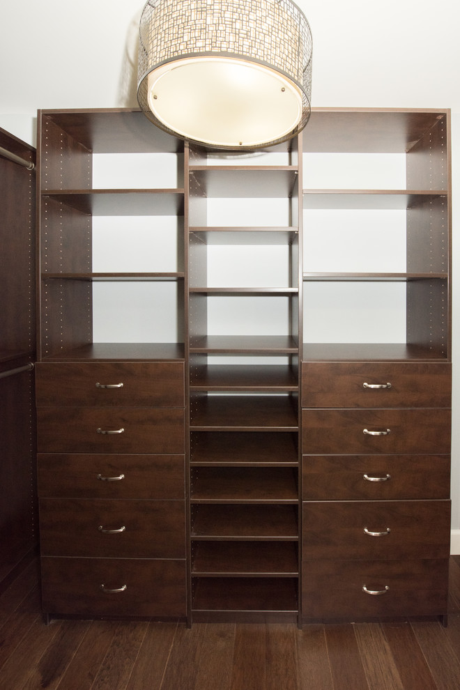 Example of a large minimalist gender-neutral carpeted and white floor walk-in closet design in Nashville with white cabinets