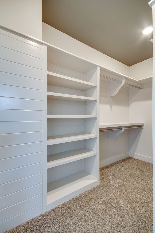 Inspiration for a large classic gender neutral walk-in wardrobe in Nashville with open cabinets, white cabinets, carpet and multi-coloured floors.