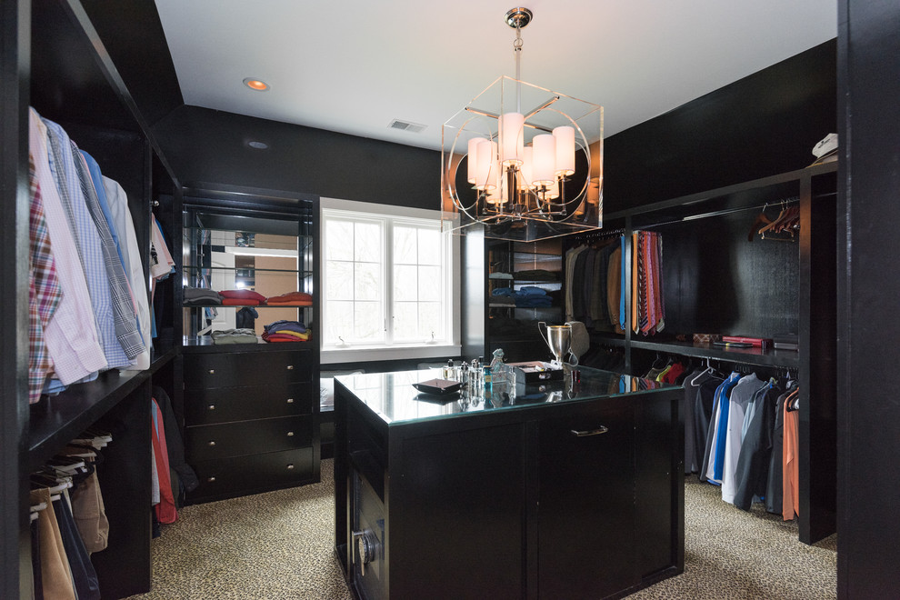 Photo of a farmhouse walk-in wardrobe in Louisville with black cabinets.