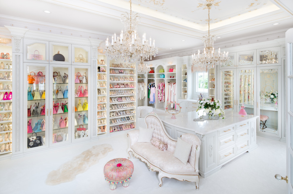 Example of a large classic women's carpeted and white floor dressing room design in Orlando with recessed-panel cabinets and white cabinets