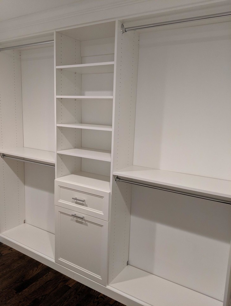 Mid-sized elegant dark wood floor and brown floor walk-in closet photo in New York with shaker cabinets and white cabinets