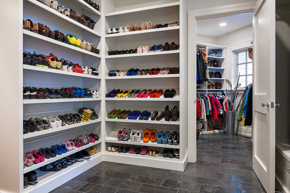 Elegant gender-neutral limestone floor walk-in closet photo in Philadelphia