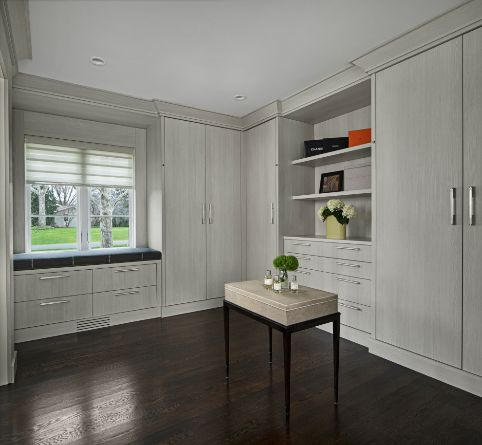 Inspiration for a large midcentury walk-in wardrobe in Detroit with flat-panel cabinets, grey cabinets, dark hardwood flooring and brown floors.