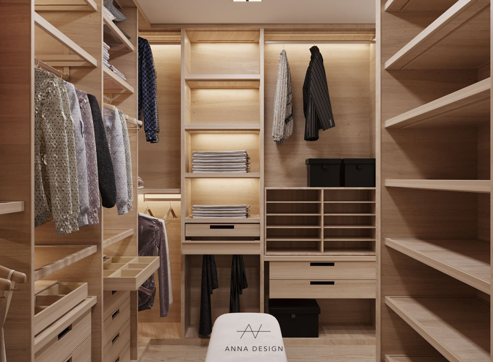 Inspiration for a mid-sized modern gender-neutral light wood floor and beige floor walk-in closet remodel in Los Angeles with flat-panel cabinets and light wood cabinets