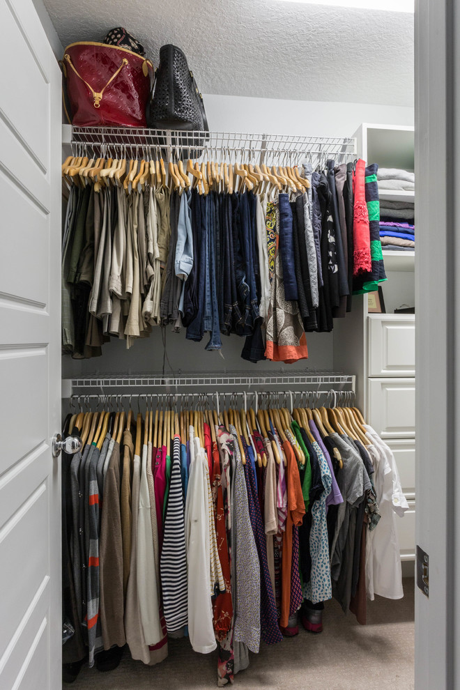 Inspiration for a mid-sized contemporary women's carpeted walk-in closet remodel in Tampa with white cabinets