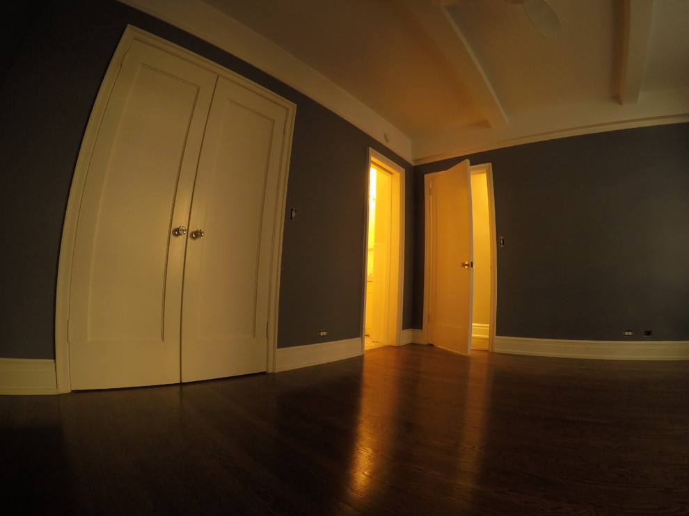 Example of a mid-sized minimalist gender-neutral light wood floor reach-in closet design in New York with beaded inset cabinets and beige cabinets