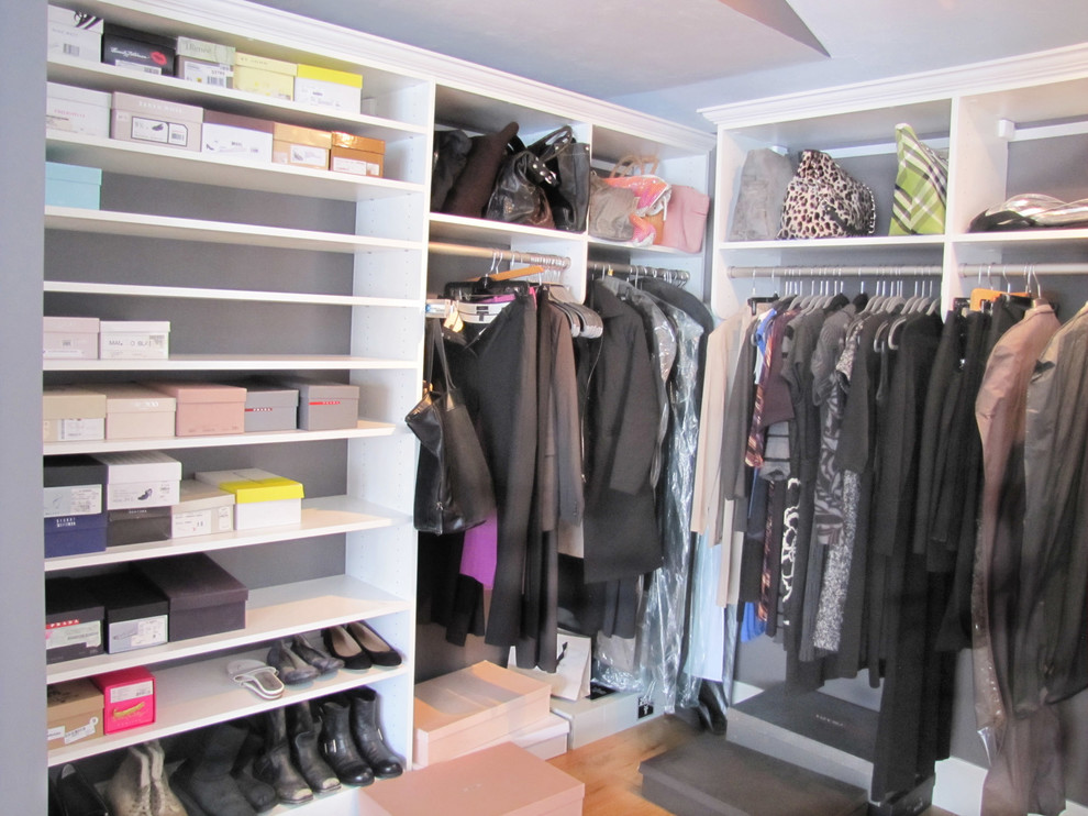 Master bedroom walkin closet with pullout ironing board, plenty of drawe Contemporary