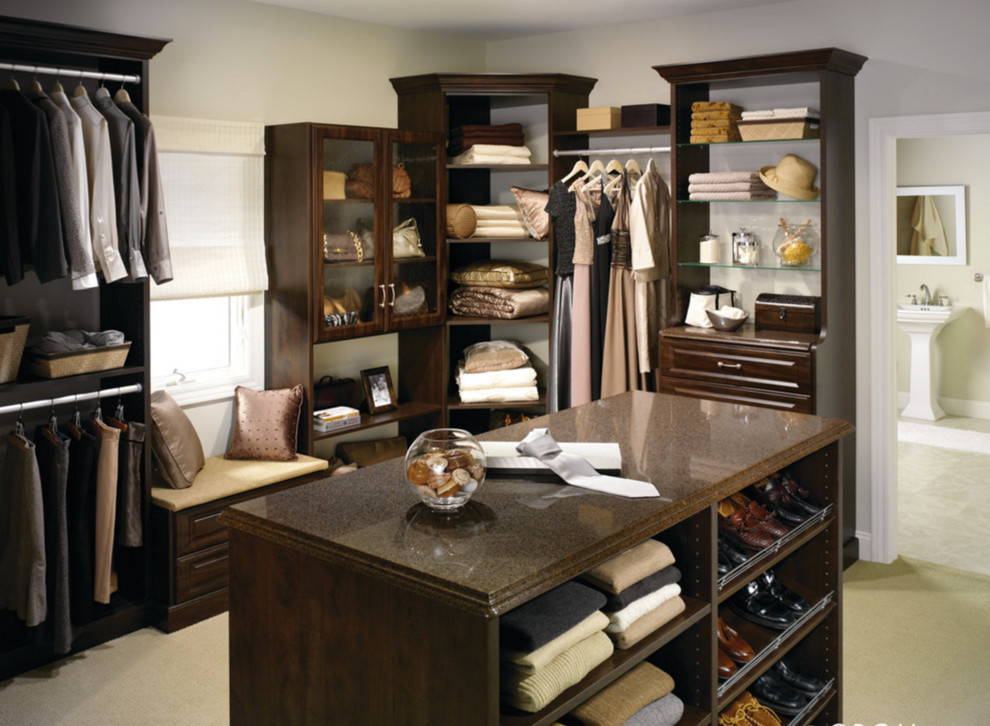 Inspiration for a classic walk-in wardrobe in New York with raised-panel cabinets.