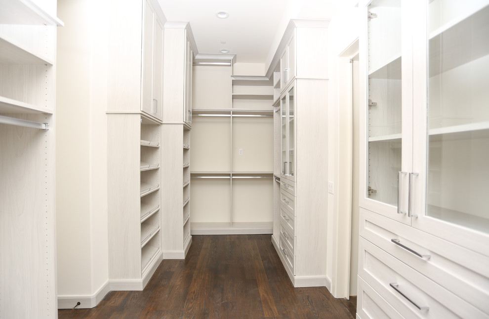 Inspiration for an expansive contemporary gender neutral walk-in wardrobe in Atlanta with brown floors, shaker cabinets, medium hardwood flooring and light wood cabinets.