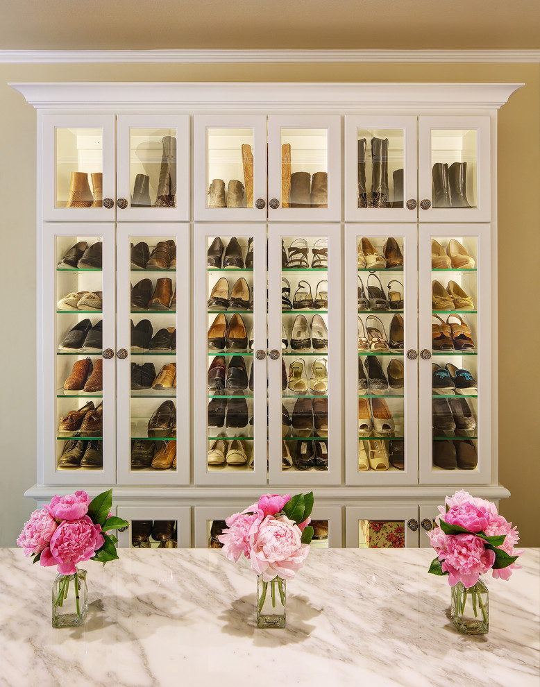 Walk-in closet - large traditional women's carpeted walk-in closet idea in Milwaukee with white cabinets