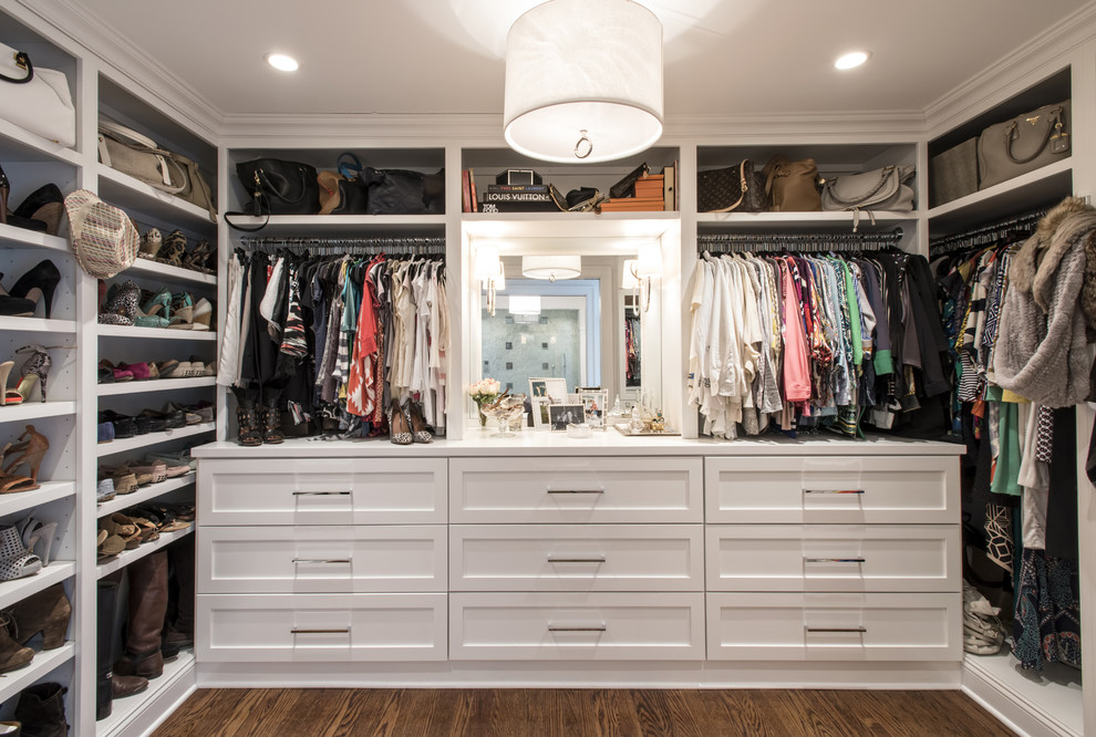 Inspiration for a large transitional women's medium tone wood floor dressing room remodel in Louisville with recessed-panel cabinets and white cabinets