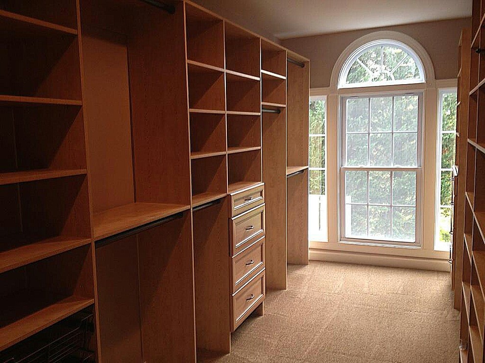 Large transitional gender-neutral walk-in closet photo in Baltimore