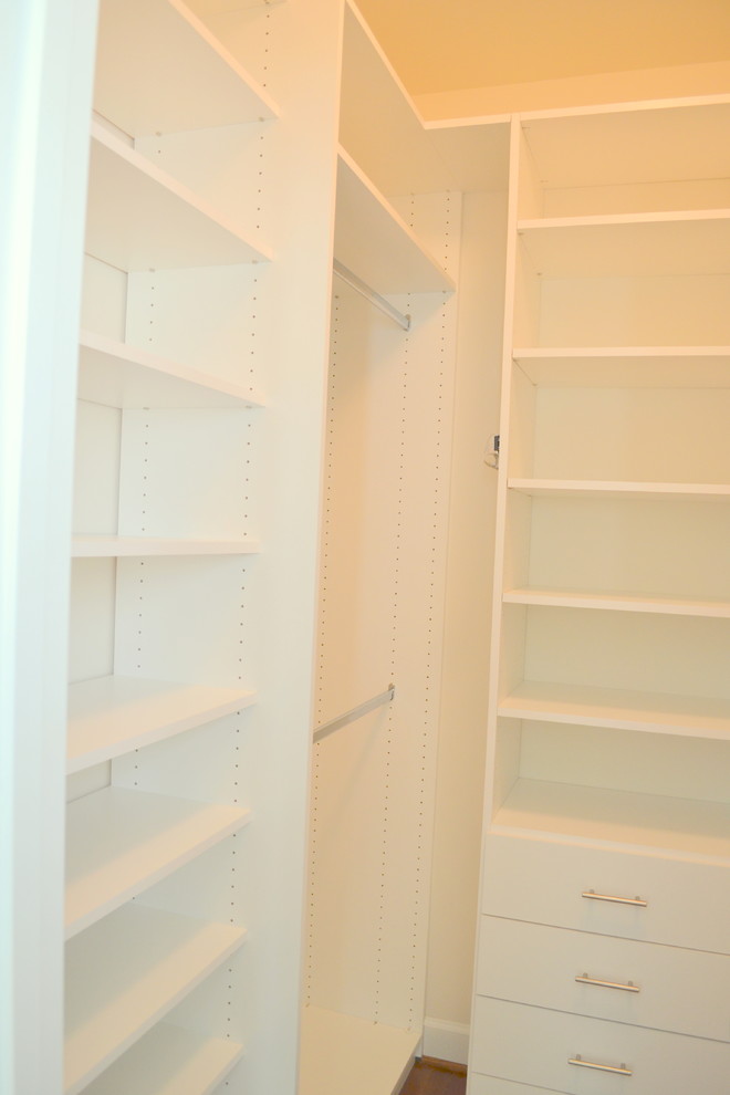 Inspiration for a mid-sized contemporary walk-in closet remodel in Salt Lake City with flat-panel cabinets and white cabinets