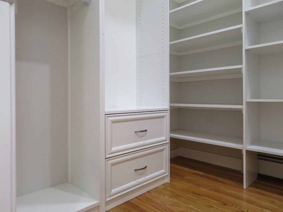 Design ideas for a medium sized classic walk-in wardrobe in Bridgeport with porcelain flooring, beige floors, raised-panel cabinets and white cabinets.