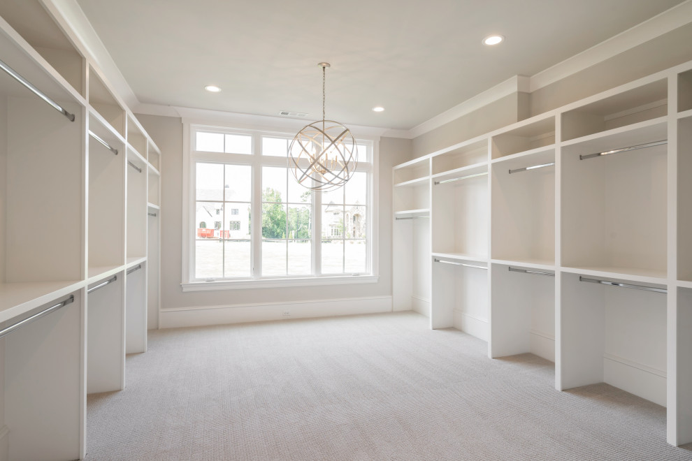 Walk-in closet - large traditional carpeted and beige floor walk-in closet idea in Atlanta with open cabinets and white cabinets