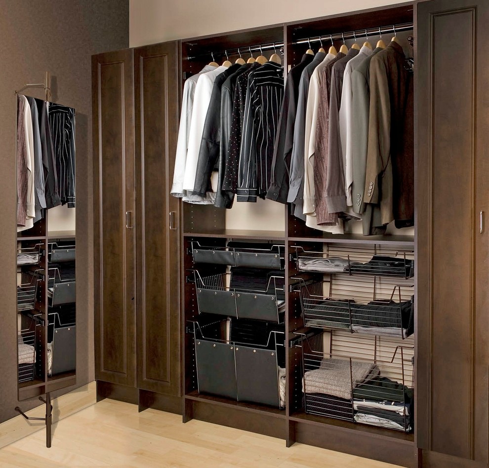 Inspiration for a medium sized urban walk-in wardrobe for men in Orange County with raised-panel cabinets, dark wood cabinets, light hardwood flooring and beige floors.