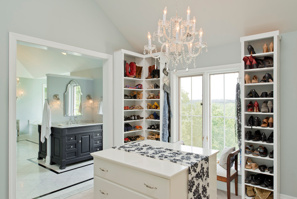 Example of a large classic gender-neutral carpeted and beige floor dressing room design in Baltimore with open cabinets and white cabinets
