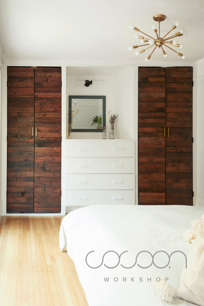 Large danish gender-neutral light wood floor dressing room photo in San Francisco with flat-panel cabinets and dark wood cabinets