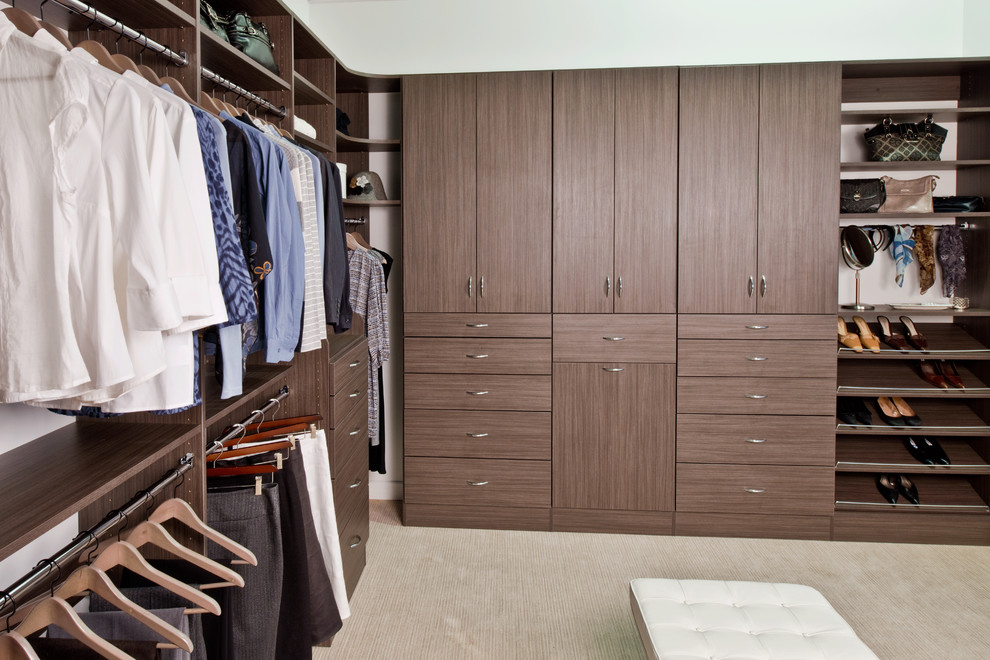 This is an example of a medium sized walk-in wardrobe in Birmingham.