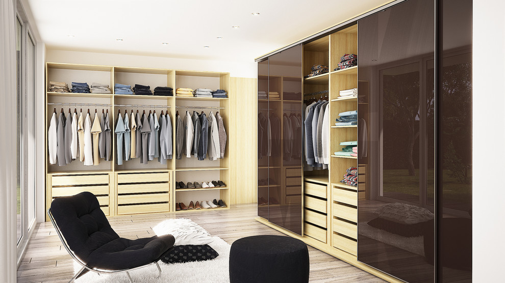 Modern walk in closet with dark brown sliding doors Modern Closet