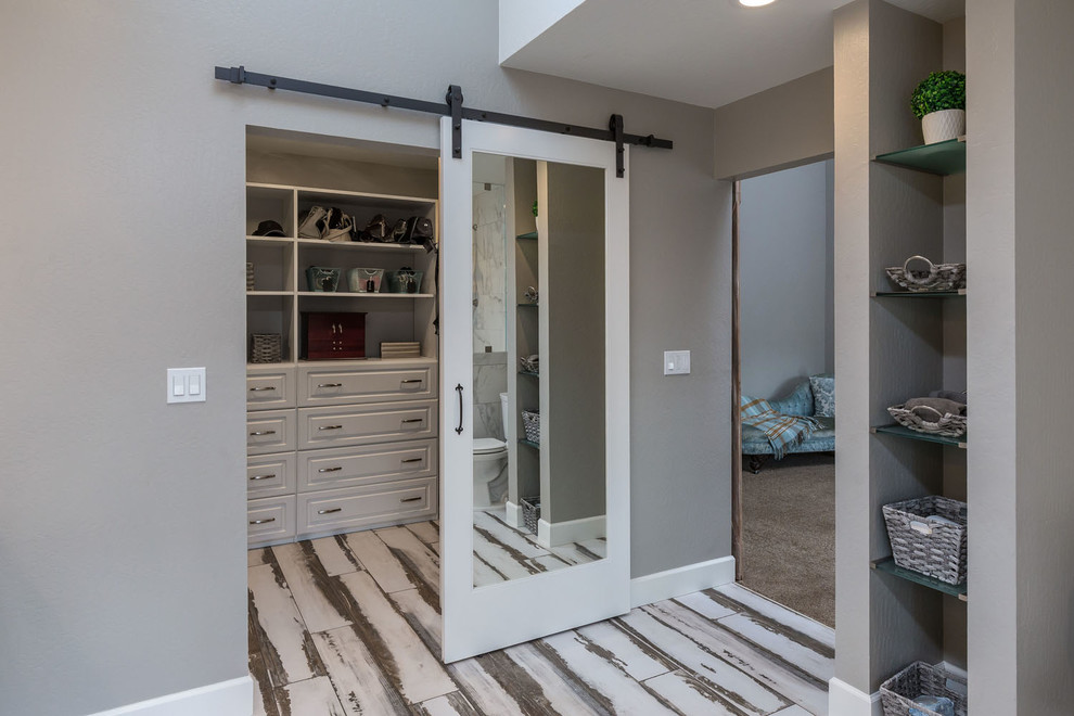 Design ideas for a medium sized classic gender neutral walk-in wardrobe in San Francisco with porcelain flooring and multi-coloured floors.