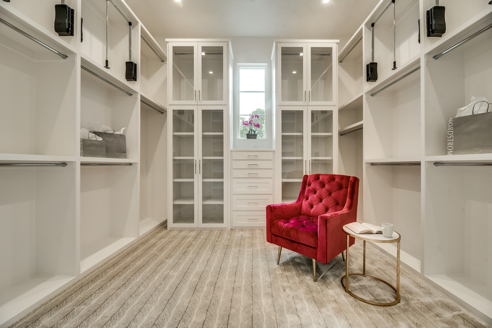 Large trendy gender-neutral carpeted walk-in closet photo in Dallas with shaker cabinets