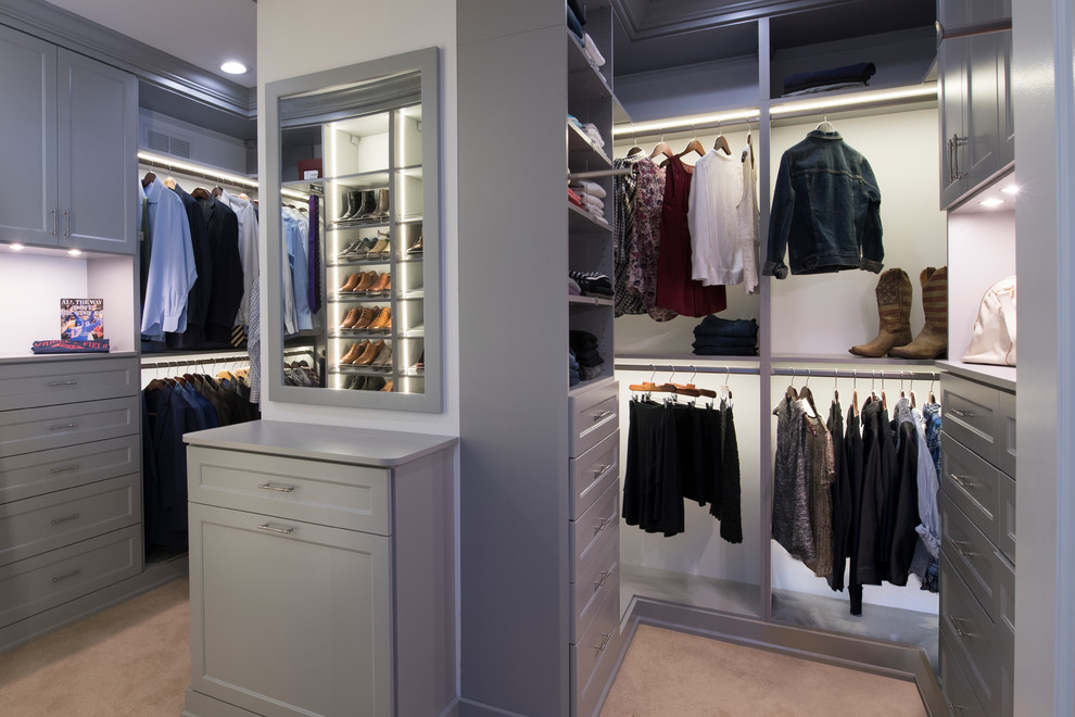 Example of a large transitional gender-neutral carpeted walk-in closet design in Chicago with recessed-panel cabinets and gray cabinets