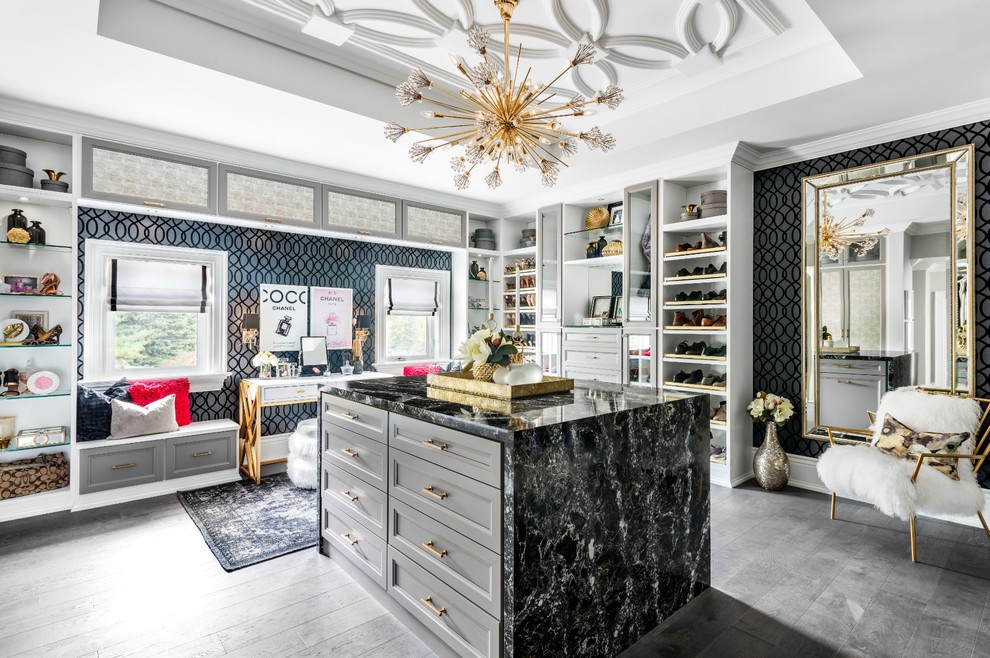 Design ideas for a classic dressing room for women in Toronto with recessed-panel cabinets, grey cabinets and grey floors.