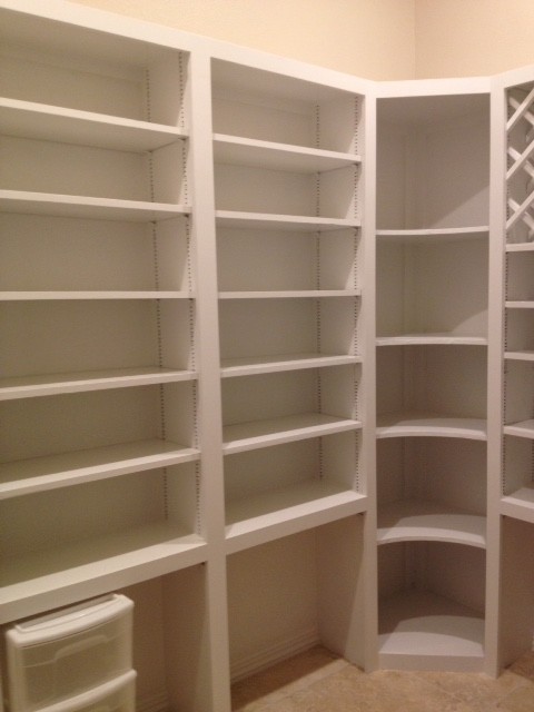 Photo of a medium sized contemporary gender neutral walk-in wardrobe in Austin with open cabinets, white cabinets, travertine flooring and beige floors.